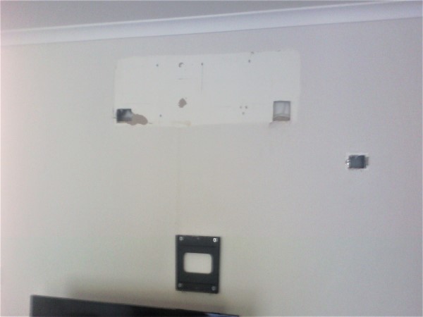 picture of holes in plaster wall